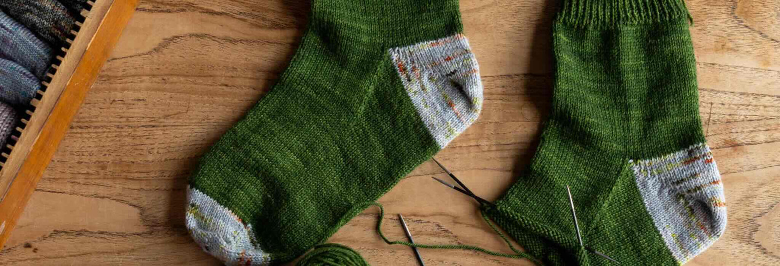 The deep shadow sock heel displayed across a finished and unfinished sock.